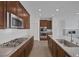 This modern kitchen features stainless steel appliances, granite countertops, and custom wood cabinetry at 489 Intonation St, Henderson, NV 89011