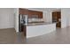 Spacious kitchen boasts a large center island, stainless steel appliances, and ample cabinetry at 489 Intonation St, Henderson, NV 89011