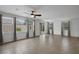 Spacious living room with tile flooring, natural light, and sliding glass door access to the backyard at 489 Intonation St, Henderson, NV 89011