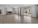 Spacious living area featuring tile flooring, a modern fireplace, and sliding glass doors to the backyard at 489 Intonation St, Henderson, NV 89011