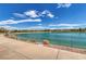 Scenic view of a tranquil pond and lush landscaping, creating a peaceful and relaxing environment at 489 Intonation St, Henderson, NV 89011