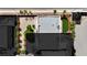 Aerial view of a modern home with a flat roof, landscaped backyard, desert plants, and a spacious driveway at 5015 Thunder River Cir, Las Vegas, NV 89148