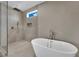 Stylish bathroom features an elegant soaking tub and a separate glass enclosed shower at 5015 Thunder River Cir, Las Vegas, NV 89148