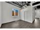 Unfurnished bedroom with dark hardwood floors and a window offering an outdoor view at 5015 Thunder River Cir, Las Vegas, NV 89148
