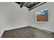 Empty bedroom with dark floors and a window providing ample natural light at 5015 Thunder River Cir, Las Vegas, NV 89148