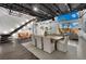 Spacious open-concept dining area with large table, modern staircase, and floor-to-ceiling windows overlooking the backyard at 5015 Thunder River Cir, Las Vegas, NV 89148