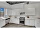 Modern kitchen with white cabinets and stainless steel appliances at 5015 Thunder River Cir, Las Vegas, NV 89148
