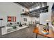 Bright, modern living room featuring a spacious seating area, unique overhead loft, and stylish decor with an open floor plan at 5015 Thunder River Cir, Las Vegas, NV 89148