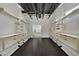 Open walk-in closet with custom shelving and cabinetry, maximizing storage and organization at 5015 Thunder River Cir, Las Vegas, NV 89148