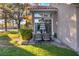 Inviting backyard with a private patio, outdoor furniture, lush lawn, mature trees, and tasteful landscaping at 5058 Crooked Stick Way, Las Vegas, NV 89113
