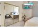 Well-lit bedroom with closet and television at 5058 Crooked Stick Way, Las Vegas, NV 89113