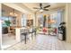 Bright breakfast nook with slider doors to patio, stylish counter stools and tile flooring at 5058 Crooked Stick Way, Las Vegas, NV 89113