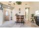 Inviting entryway with custom bar, light walls, and lots of light at 5058 Crooked Stick Way, Las Vegas, NV 89113
