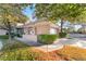 Charming home featuring lovely landscaping, and mature shade trees at 5058 Crooked Stick Way, Las Vegas, NV 89113