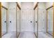 Hallway with multiple mirrored closet doors creating the illusion of expanded space at 5058 Crooked Stick Way, Las Vegas, NV 89113