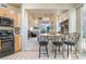 Stylish breakfast bar in the kitchen provides views into the adjacent living room at 5058 Crooked Stick Way, Las Vegas, NV 89113