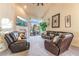 Spacious living room with cozy fireplace, comfortable seating, and bright, open feel at 5058 Crooked Stick Way, Las Vegas, NV 89113