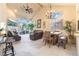 Open living area with vaulted ceilings, modern fireplace, and beautiful chandelier at 5058 Crooked Stick Way, Las Vegas, NV 89113
