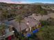 Overhead view of property highlighting pool, outdoor living spaces, lush landscaping, and mountain backdrop at 51 Avenida Sorrento, Henderson, NV 89011