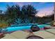 Inviting backyard oasis featuring a pool, fire pit, and comfortable lounge seating at 51 Avenida Sorrento, Henderson, NV 89011