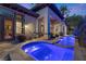 Stunning backyard features a pool with vibrant lighting and seamless indoor-outdoor living spaces at 51 Avenida Sorrento, Henderson, NV 89011