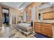 Bathroom with a large soaking tub on a raised platform, double vanities, tile flooring and recessed lighting at 51 Avenida Sorrento, Henderson, NV 89011
