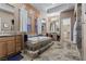 Bathroom with a large soaking tub on a raised platform, double vanities, tile flooring and recessed lighting at 51 Avenida Sorrento, Henderson, NV 89011