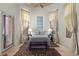Bedroom with cathedral ceiling, a bed, two side tables, curtains, blinds and an area rug at 51 Avenida Sorrento, Henderson, NV 89011