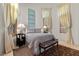 Bedroom with cathedral ceiling, a bed, two side tables, curtains, blinds and an area rug at 51 Avenida Sorrento, Henderson, NV 89011