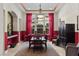 Formal dining room featuring large windows, red curtains, modern chandelier, and seating for six at 51 Avenida Sorrento, Henderson, NV 89011