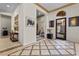 Grand foyer boasts decorative tile flooring, arched entryway, and stylish decor for an inviting entrance at 51 Avenida Sorrento, Henderson, NV 89011