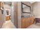 Hallway featuring a vanity, cabinets, and a view into a bathroom at 51 Avenida Sorrento, Henderson, NV 89011