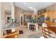 A spacious kitchen featuring wood cabinets, granite counters, stainless appliances, and an island with barstool seating at 51 Avenida Sorrento, Henderson, NV 89011