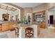 Bright kitchen with granite countertops, an island with barstool seating, and stainless steel appliances at 51 Avenida Sorrento, Henderson, NV 89011