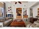 Cozy living room with fireplace, built-in shelving and entertainment center, and comfortable seating at 51 Avenida Sorrento, Henderson, NV 89011