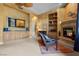 Main bedroom with sitting area, fireplace, and built-in cabinets at 51 Avenida Sorrento, Henderson, NV 89011