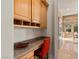 Office nook with built in desk and cabinets, and adjoining access to the kitchen at 51 Avenida Sorrento, Henderson, NV 89011