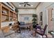 Comfortable office space with custom shelving, a ceiling fan, and ample natural light at 51 Avenida Sorrento, Henderson, NV 89011