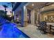 Spacious covered patio overlooking a dazzling pool with LED lighting, ideal for evening relaxation and entertaining at 51 Avenida Sorrento, Henderson, NV 89011