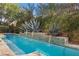 Stunning pool with water features set against lush landscaping, creating a serene and private outdoor oasis at 51 Avenida Sorrento, Henderson, NV 89011