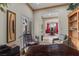 Sitting room featuring French doors, a decorative bookshelf, and a view into a dining area at 51 Avenida Sorrento, Henderson, NV 89011