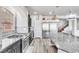 Kitchen with stainless steel appliances, granite countertops, and a view of the staircase at 5976 Rockway Glen Ave, Las Vegas, NV 89141