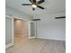 Bedroom featuring wood-look flooring, gray walls, and a door leading to another room at 6085 Ryan Ranch Ave, Las Vegas, NV 89130