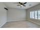 Serene bedroom with neutral walls, plantation shutters, and a modern ceiling fan at 6085 Ryan Ranch Ave, Las Vegas, NV 89130