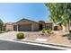 Charming single-story home with a three-car garage and well-maintained desert landscaping at 6085 Ryan Ranch Ave, Las Vegas, NV 89130