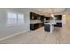Modern kitchen features stainless appliances, center island and stylish pendant lighting at 6085 Ryan Ranch Ave, Las Vegas, NV 89130
