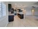Modern kitchen features stainless appliances, center island and stylish pendant lighting at 6085 Ryan Ranch Ave, Las Vegas, NV 89130