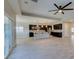 Modern kitchen features stainless appliances, center island and stylish pendant lighting at 6085 Ryan Ranch Ave, Las Vegas, NV 89130