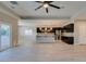 Modern kitchen features stainless appliances, center island and stylish pendant lighting at 6085 Ryan Ranch Ave, Las Vegas, NV 89130