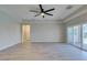 Open floor plan with wood-look floors, recessed lighting, and sliding doors to the backyard at 6085 Ryan Ranch Ave, Las Vegas, NV 89130